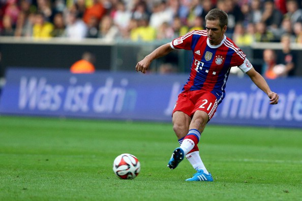 DORTMUND, GERMANY - AUGUST 13: Philipp Lahm of Bayern Muenchen runs with the ball during the DFL Supercup match between Borussia Dortmund and FC Bayern Muenchen at Signal Iduna Park on August 13, 2014 in Dortmund, Germany. (Photo by Christof Koepsel/Bongarts/Getty Images)