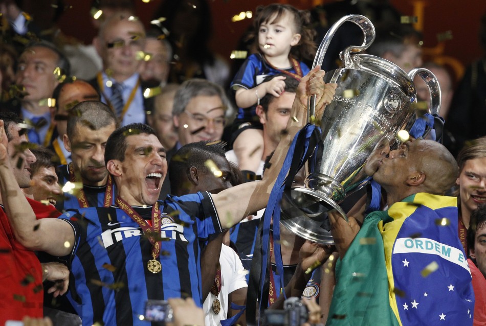67962-inter-milans-lucio-and-maicon-celebrate-with-the-trophy-following-thei