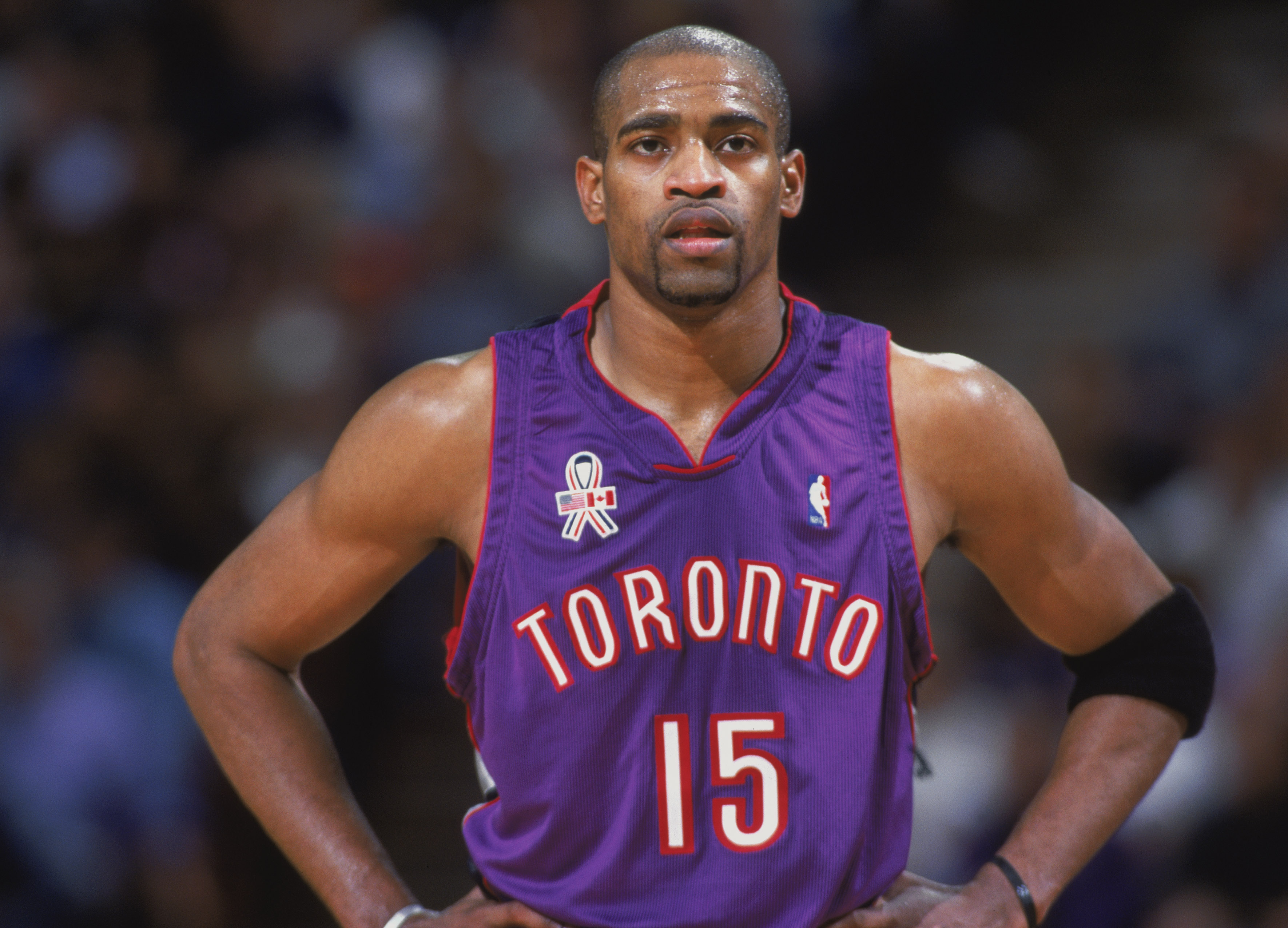 Vince Carter looks on